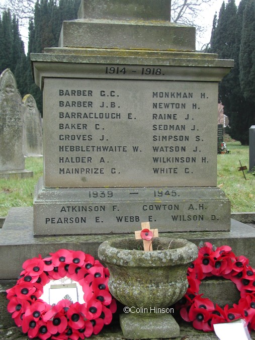 The 1914-18 and 1939-45 War Memorial in the Churchyard at East Ayton.