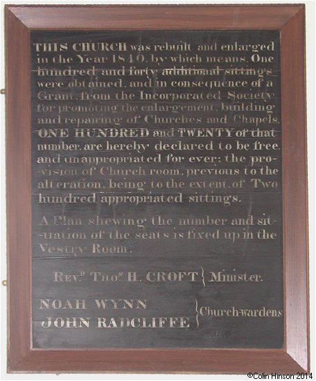 The Church enlargement plaque in St. Nicholas's Church, Stillington.